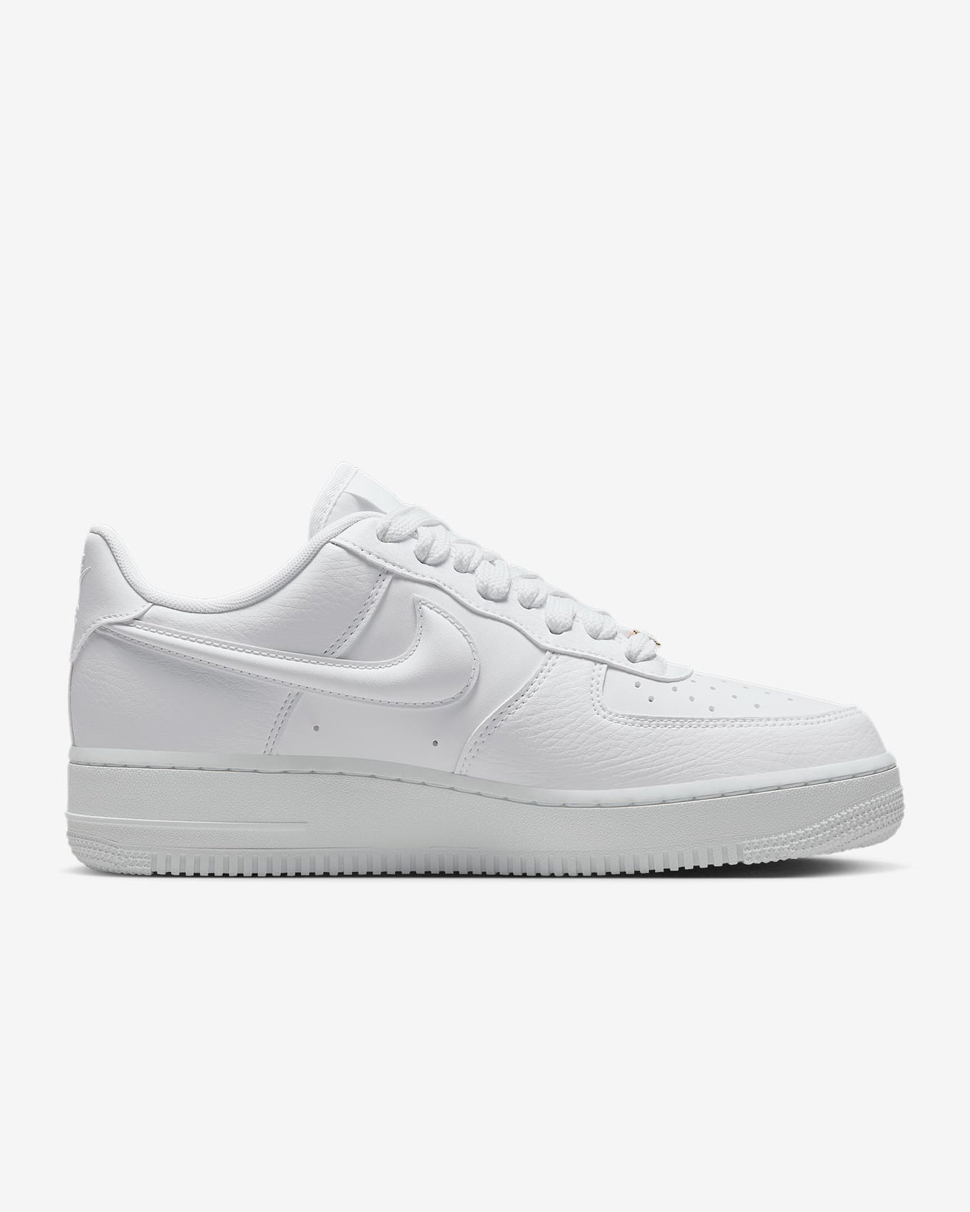 Nike Air Force 1 sneaker with classic ‘80s design, puffy Swoosh logo, and metal dubrae for a timeless and stylish look.