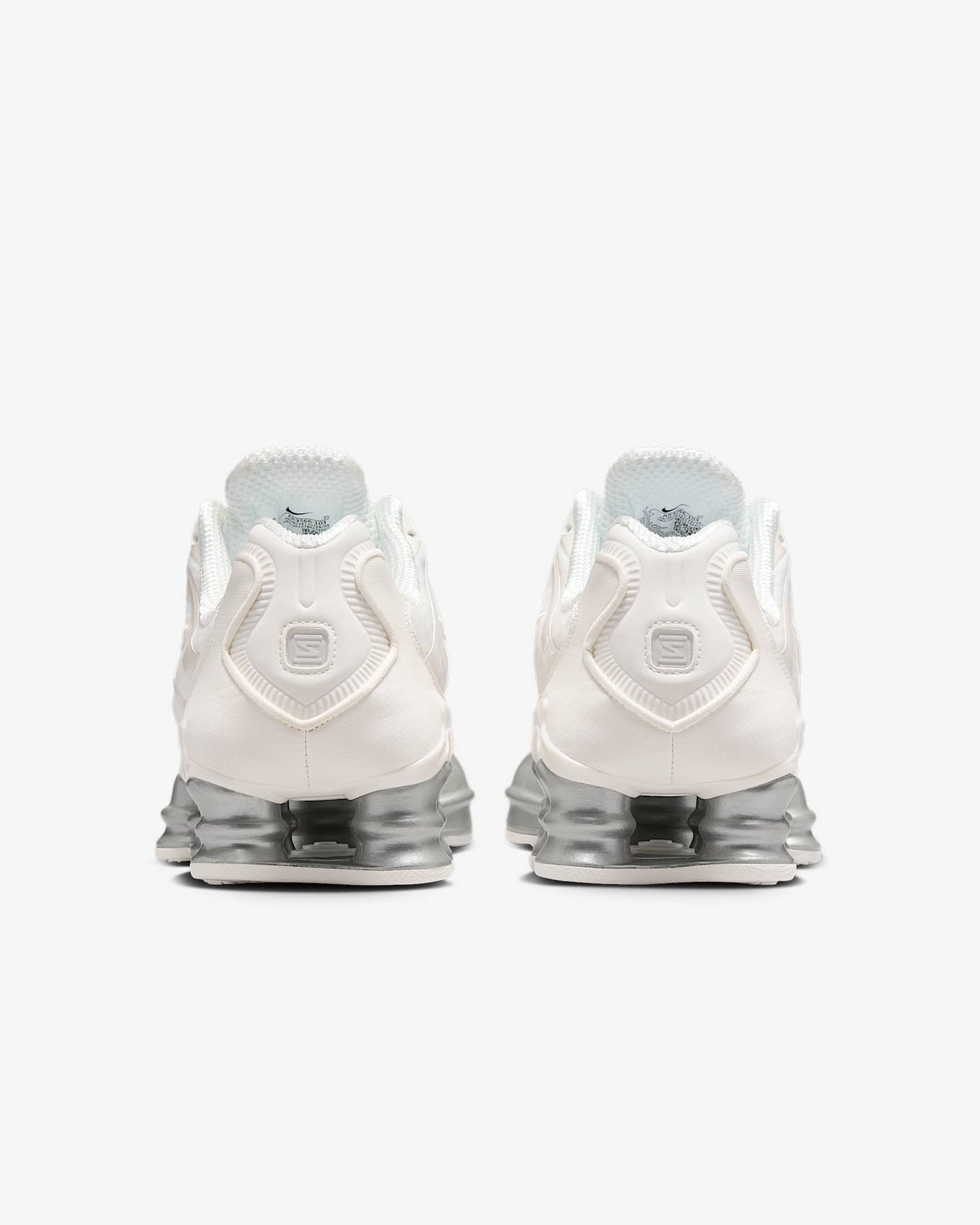 Nike Shox TL sneakers with full-length Shox cushioning and mesh upper in a tech-inspired design.
