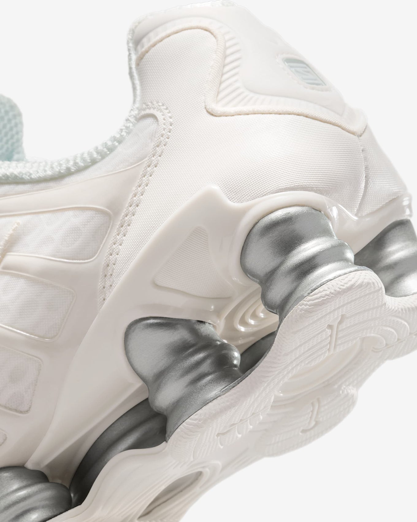 Nike Shox TL sneakers with full-length Shox cushioning and mesh upper in a tech-inspired design.