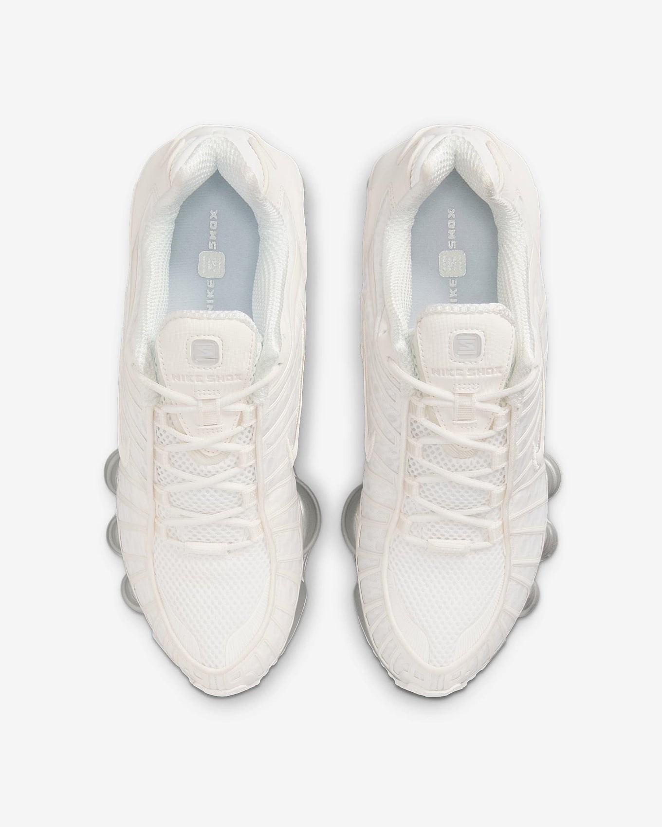 Nike Shox TL sneakers with full-length Shox cushioning and mesh upper in a tech-inspired design.