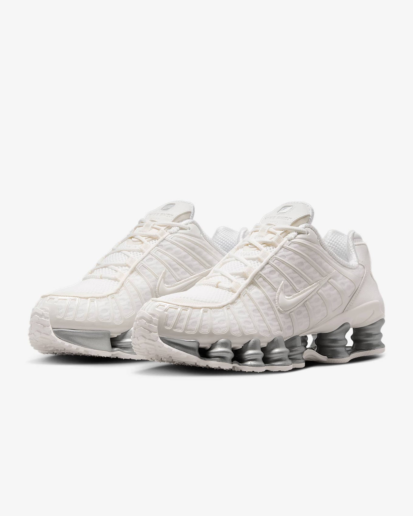 Nike Shox TL sneakers with full-length Shox cushioning and mesh upper in a tech-inspired design.
