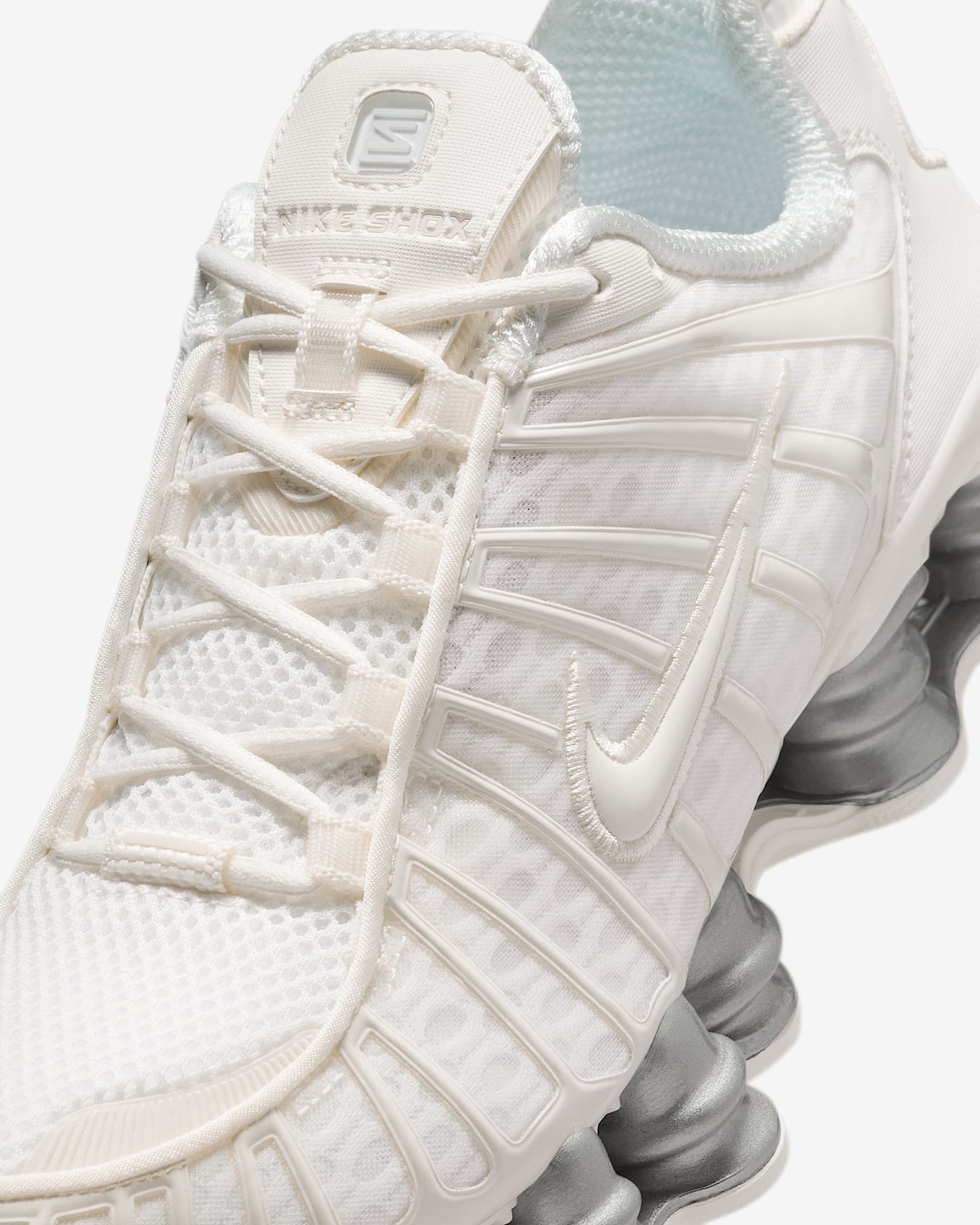Nike Shox TL sneakers with full-length Shox cushioning and mesh upper in a tech-inspired design.