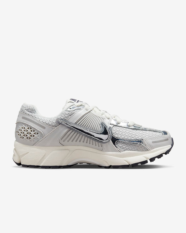 Nike Zoom Vomero 5 sneaker in neutral colorway with layered textures and metallic Swoosh detailing