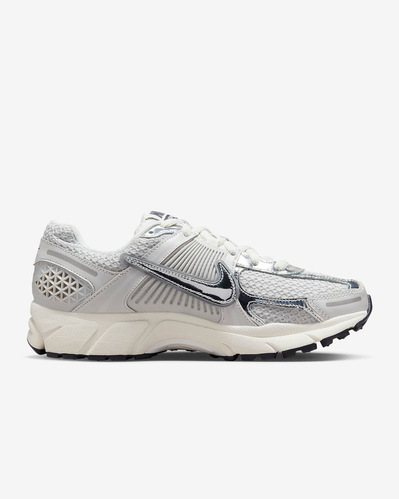Nike Zoom Vomero 5 sneaker in neutral colorway with layered textures and metallic Swoosh detailing