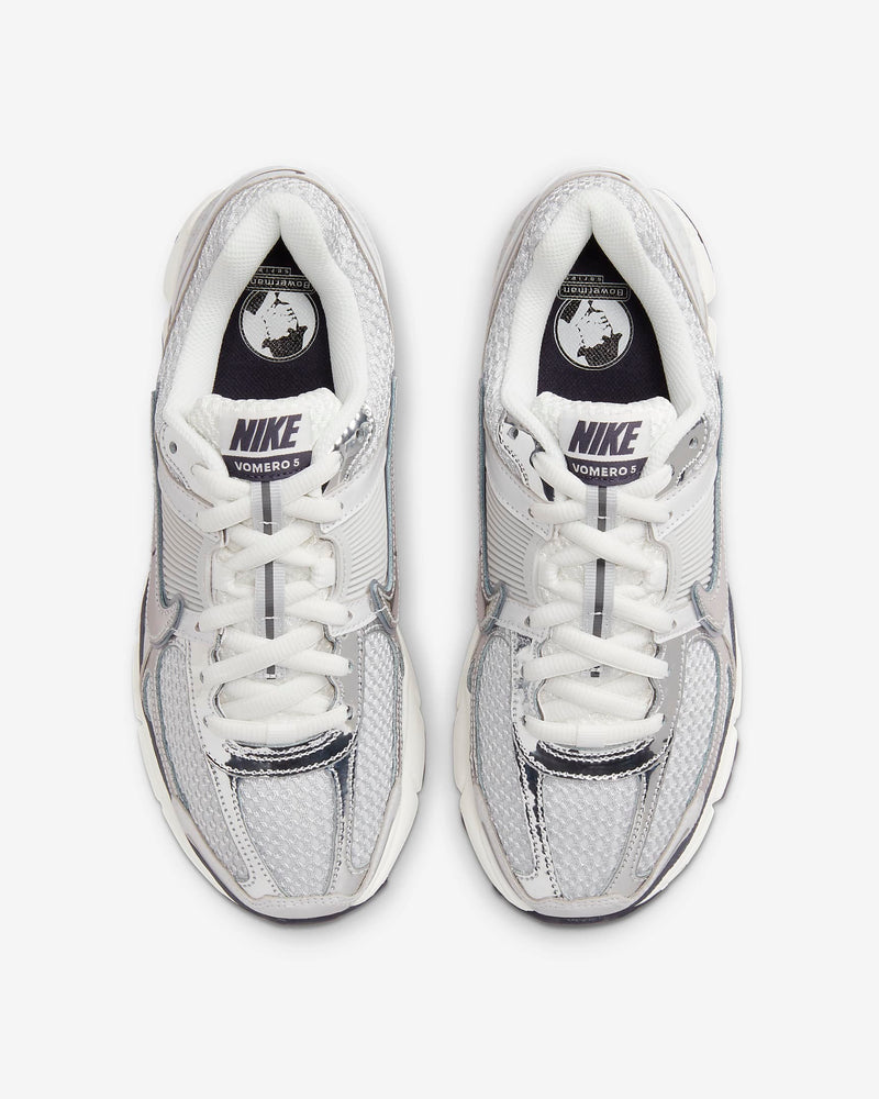Nike Zoom Vomero 5 sneaker in neutral colorway with layered textures and metallic Swoosh detailing