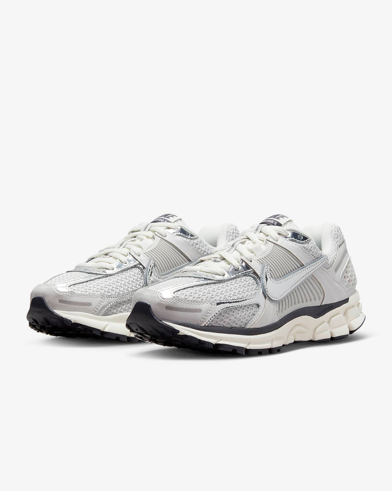 Nike Zoom Vomero 5 sneaker in neutral colorway with layered textures and metallic Swoosh detailing