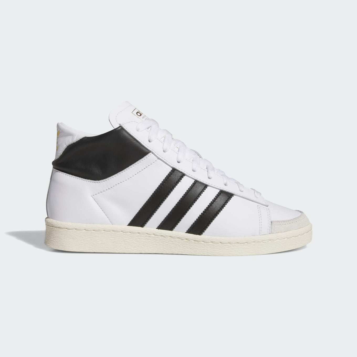 adidas Jabbar Hi sneakers with a leather upper, suede toe cap, and vintage basketball-inspired design for a timeless streetwear look.