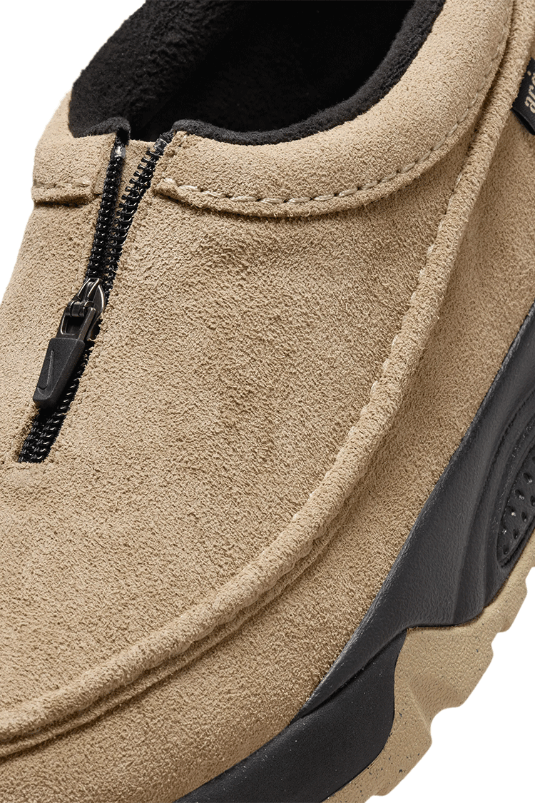 Nike ACG Izy sneaker with Khaki suede upper, black accents, plush cushioning, and a rugged outsole for all-day comfort and durability.