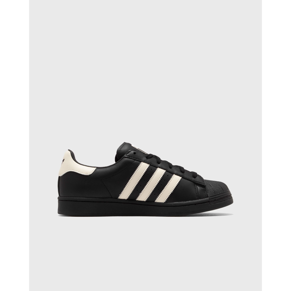 AVAVAV x adidas Originals Superstar sneaker featuring oversized, finger-like extensions on the shell toe with signature three stripes and co-branded details.