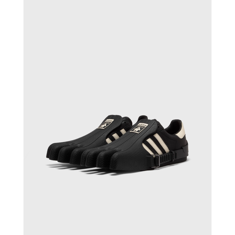 AVAVAV x adidas Originals Superstar sneaker featuring oversized, finger-like extensions on the shell toe with signature three stripes and co-branded details.