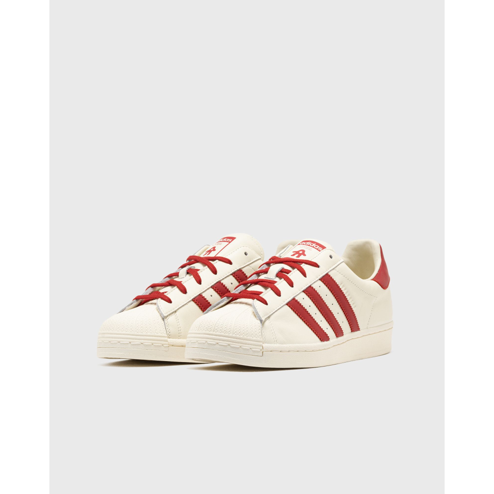 AVAVAV x adidas Originals Superstar sneaker featuring oversized, finger-like extensions on the shell toe with signature three stripes and co-branded details.