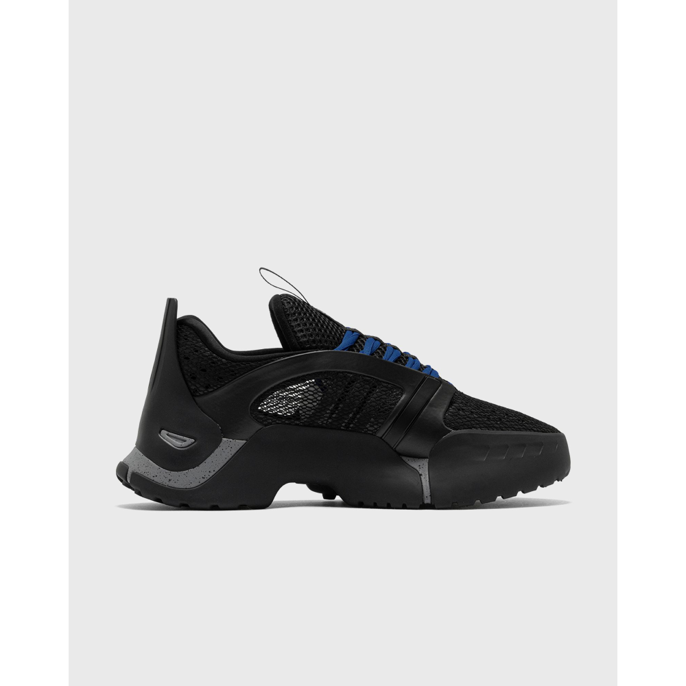 ADIDAS Kouza DYZ sneaker with a futuristic silhouette and sculpted sole in a bold streetwear style.