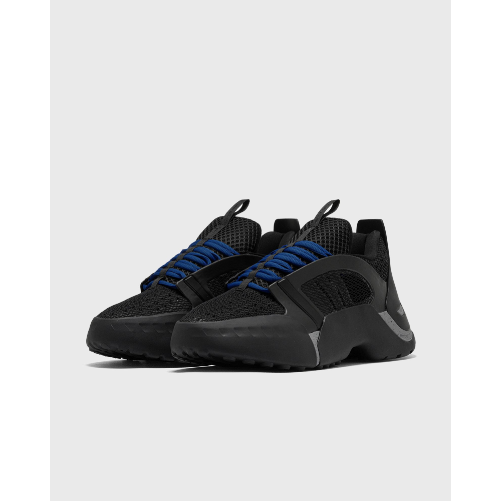 ADIDAS Kouza DYZ sneaker with a futuristic silhouette and sculpted sole in a bold streetwear style.