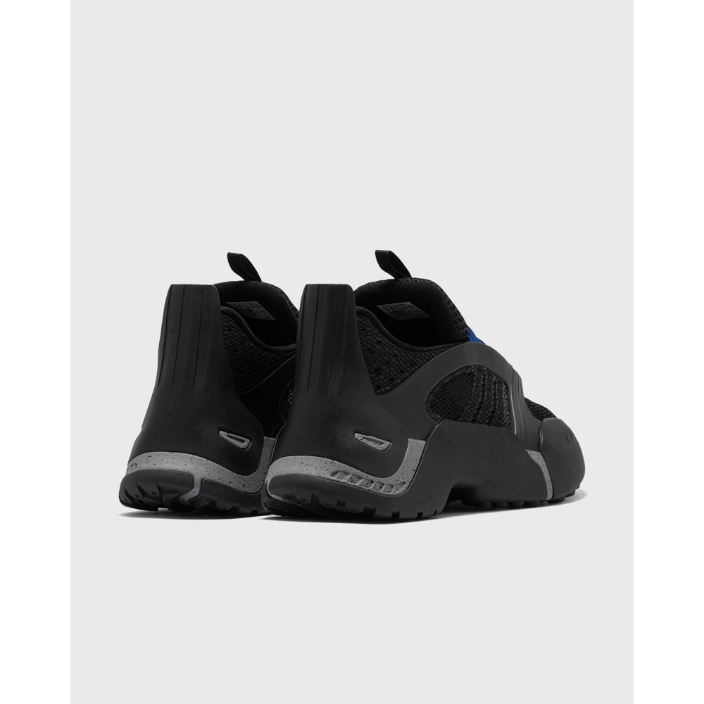 ADIDAS Kouza DYZ sneaker with a futuristic silhouette and sculpted sole in a bold streetwear style.