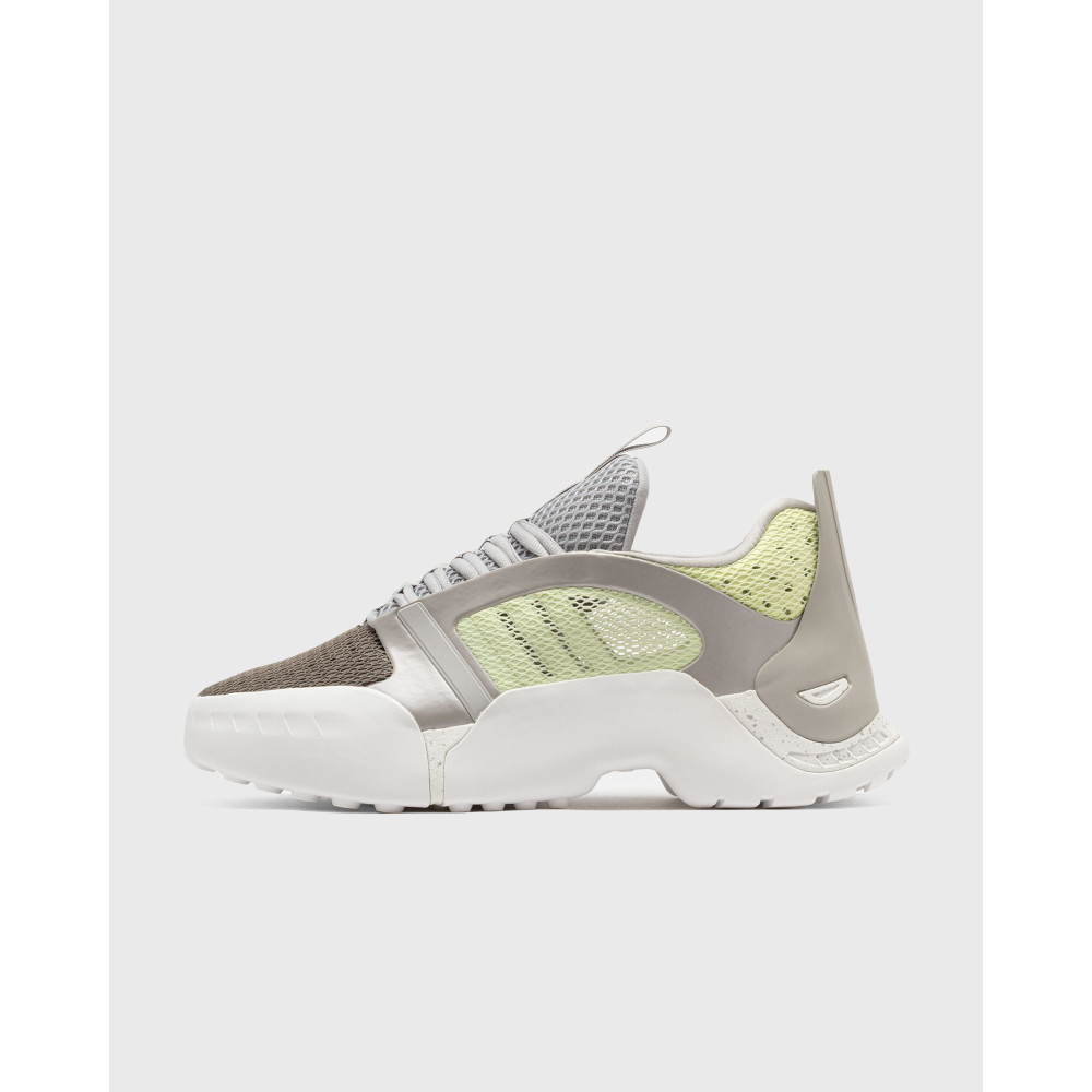 ADIDAS Kouza DYZ sneaker with a futuristic silhouette and sculpted sole in a bold streetwear style.