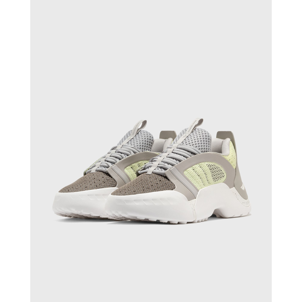 ADIDAS Kouza DYZ sneaker with a futuristic silhouette and sculpted sole in a bold streetwear style.