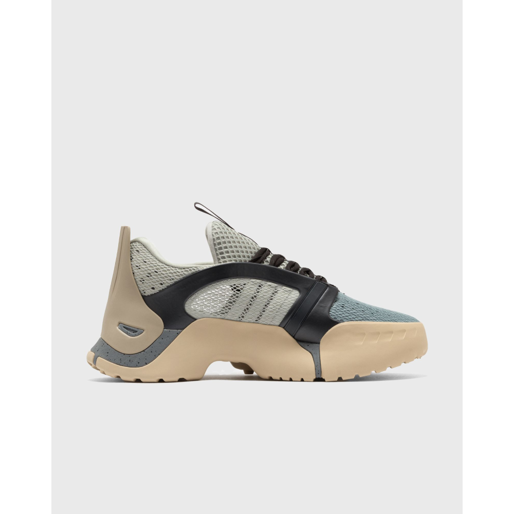 ADIDAS Kouza DYZ sneaker with a futuristic silhouette and sculpted sole in a bold streetwear style.