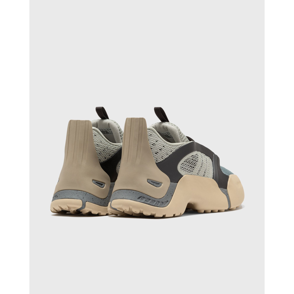 ADIDAS Kouza DYZ sneaker with a futuristic silhouette and sculpted sole in a bold streetwear style.