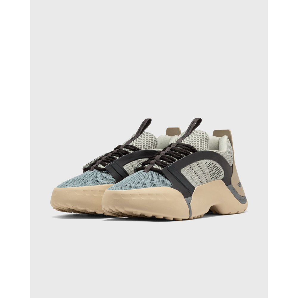 ADIDAS Kouza DYZ sneaker with a futuristic silhouette and sculpted sole in a bold streetwear style.