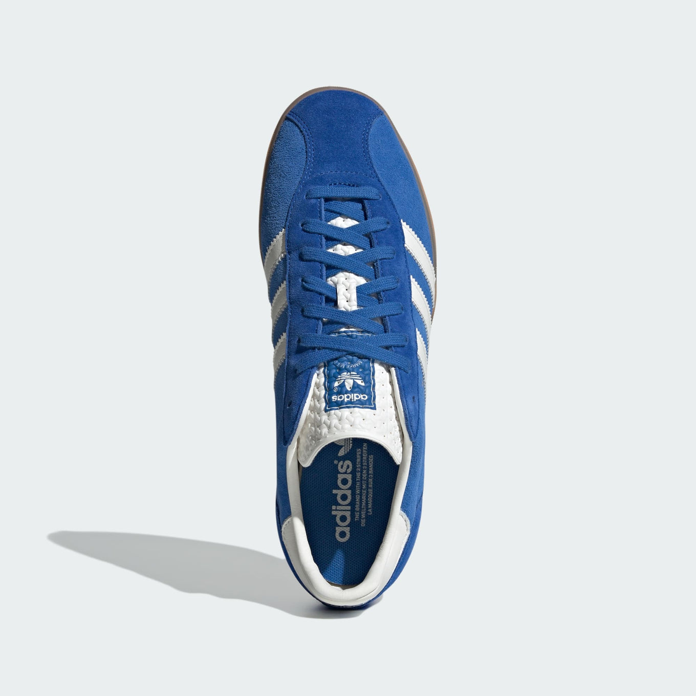 adidas Gazelle Indoor Pro shoes with a suede upper, leather lining, translucent wrapped sole, and signature 3-Stripes, blending vintage sports heritage with contemporary street style.