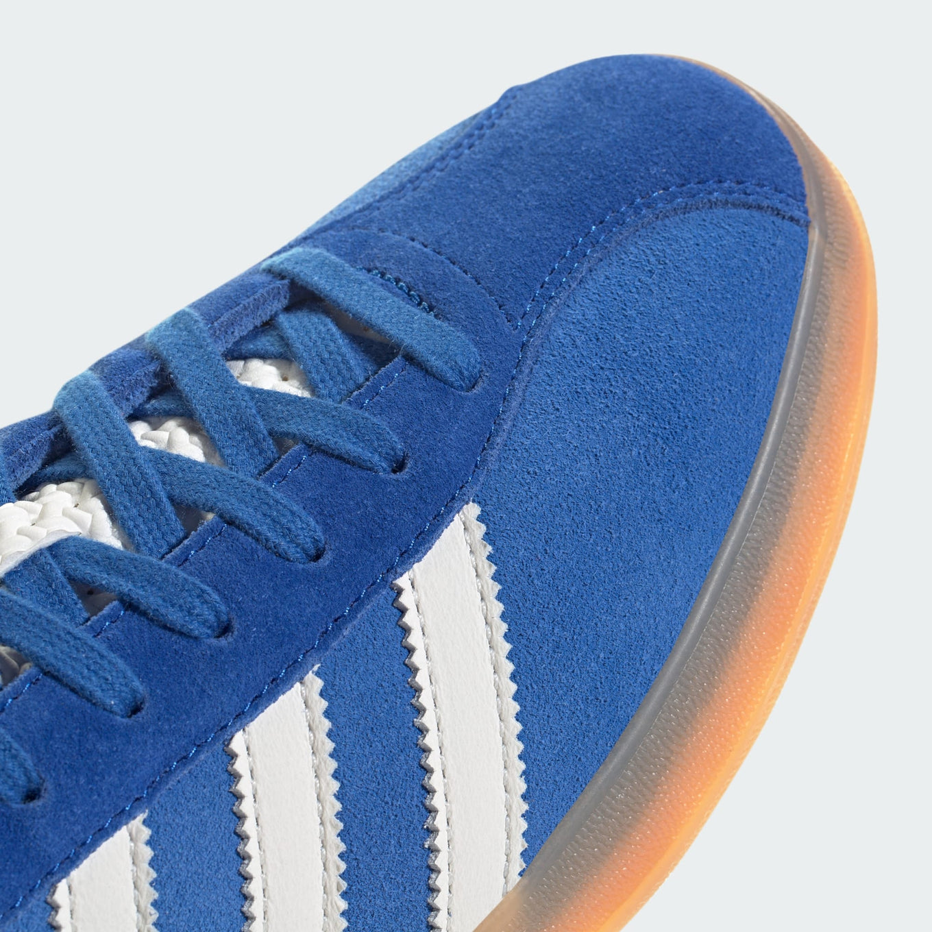 adidas Gazelle Indoor Pro shoes with a suede upper, leather lining, translucent wrapped sole, and signature 3-Stripes, blending vintage sports heritage with contemporary street style.
