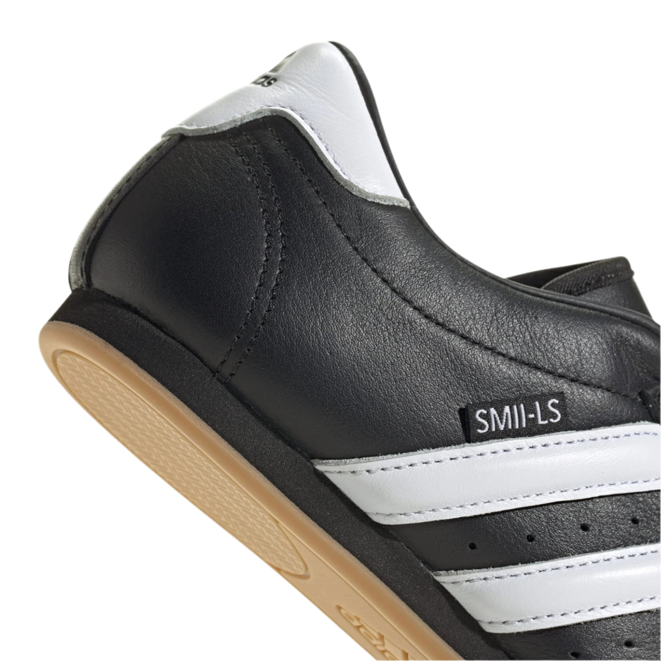Adidas Taekwondo shoes in soft leather with slip-on design, featuring bold 3-Stripes, unique forefoot stitching, and low-profile rubber outsole.


