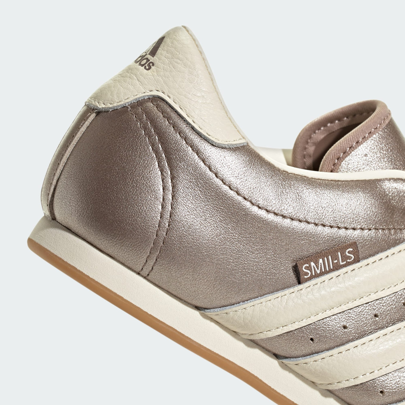 adidas Taekwondo slip-on shoes with a glossy quilted leather upper, ultra-low-profile sole, and signature 3-Stripes for a modern yet retro look.