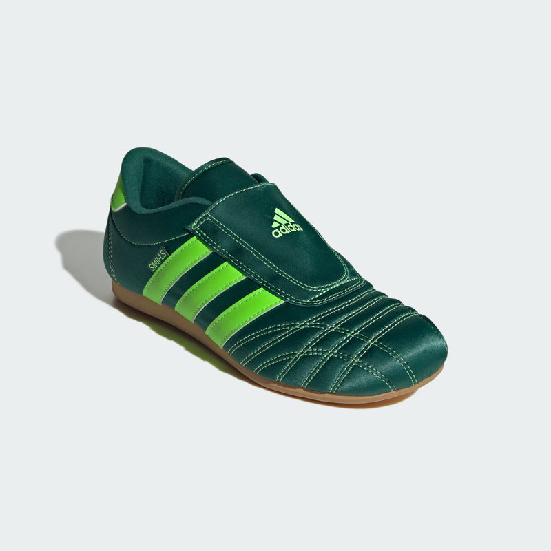 adidas slip-on shoes with smooth upper, curved stitching, and low-profile design inspired by 2000s Taekwondo trainers
