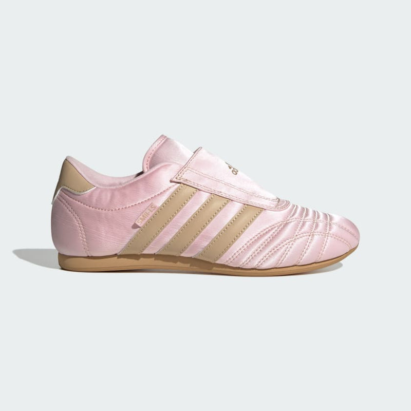 adidas slip-on shoes with smooth upper, curved stitching, and low-profile design inspired by 2000s Taekwondo trainers