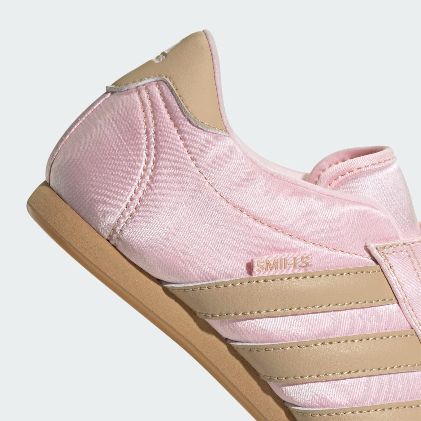 adidas slip-on shoes with smooth upper, curved stitching, and low-profile design inspired by 2000s Taekwondo trainers