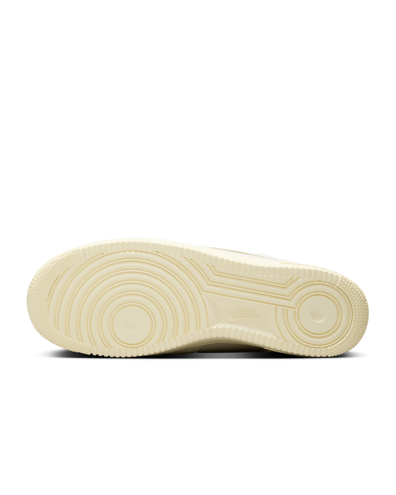 Nike Air Force 1 sneaker in Phantom and Light Bone with tumbled leather, shaggy suede details, and Coconut Milk accents for a neutral, stylish look.