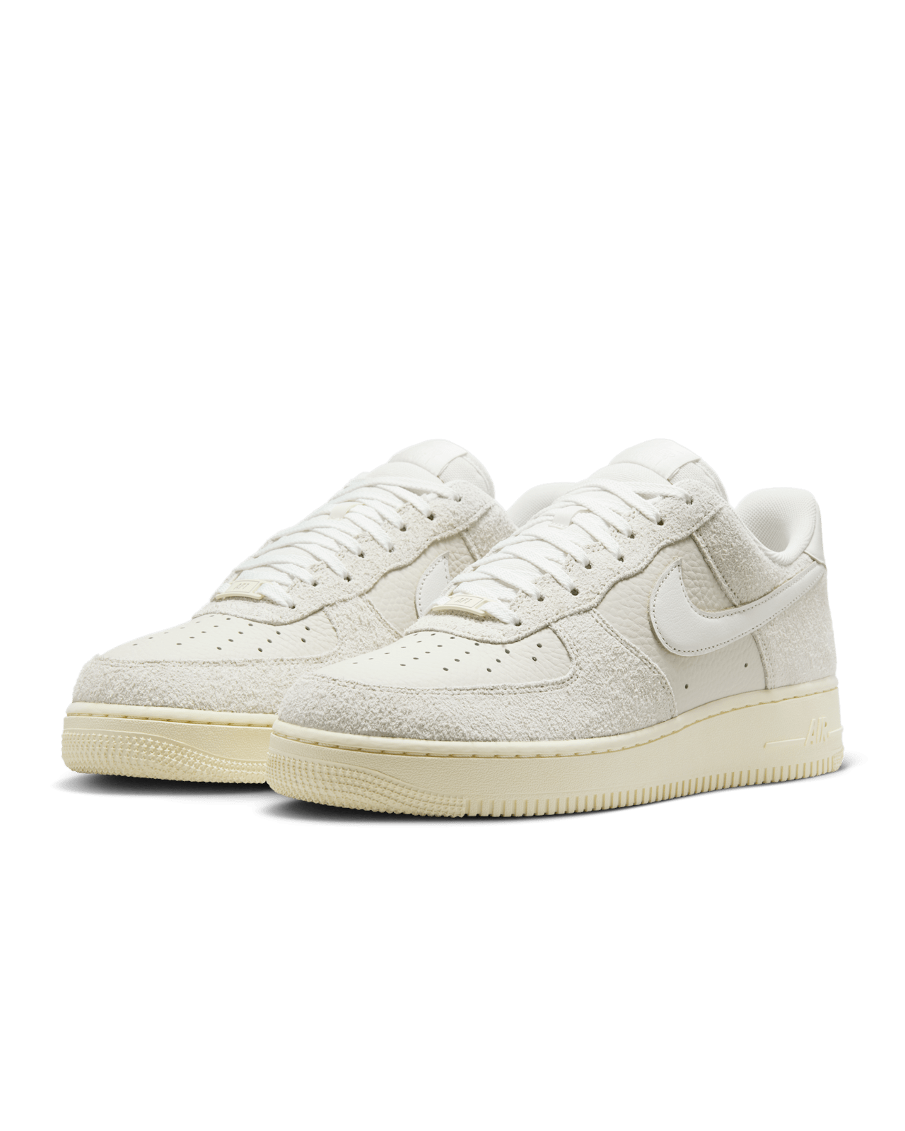 Nike Air Force 1 sneaker in Phantom and Light Bone with tumbled leather, shaggy suede details, and Coconut Milk accents for a neutral, stylish look.
