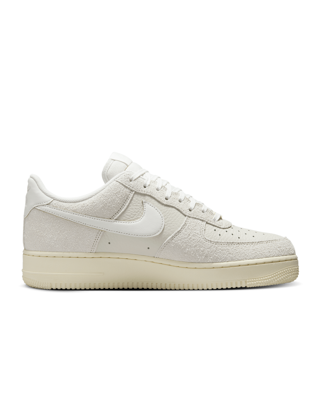 Nike Air Force 1 sneaker in Phantom and Light Bone with tumbled leather, shaggy suede details, and Coconut Milk accents for a neutral, stylish look.
