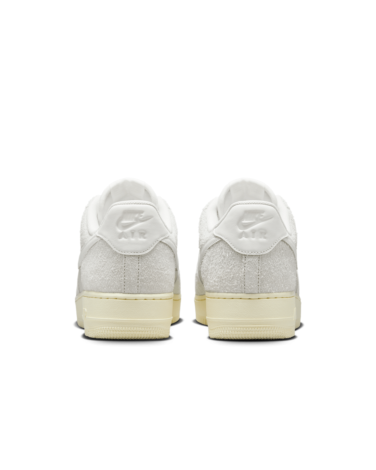 Nike Air Force 1 sneaker in Phantom and Light Bone with tumbled leather, shaggy suede details, and Coconut Milk accents for a neutral, stylish look.