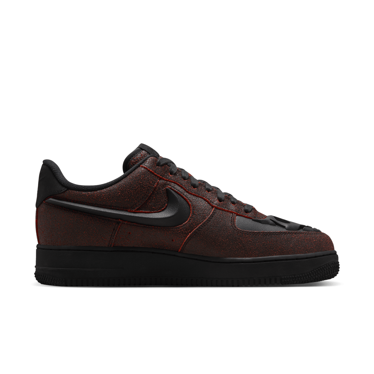Spooky AF-1 sneakers with crackled leather finish and skull etching on toe box.