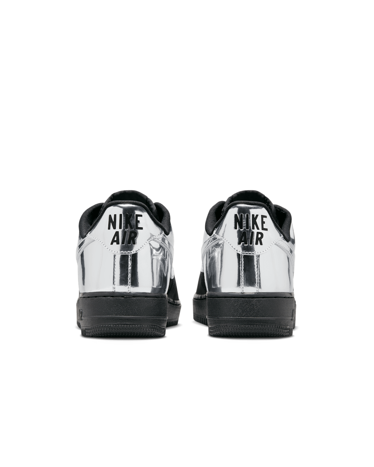 Nike Air Force 1 shoes with black suede upper, chrome accents, reflective graffiti print, and star-shaped dubraes inspired by hip-hop culture