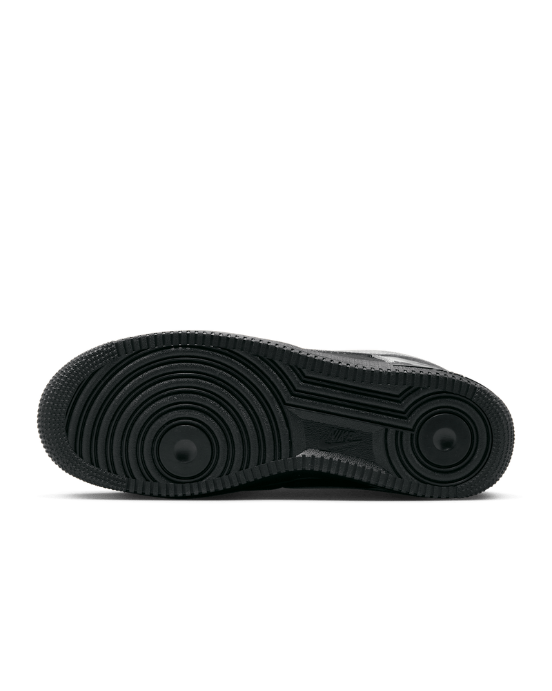 Nike Air Force 1 shoes with black suede upper, chrome accents, reflective graffiti print, and star-shaped dubraes inspired by hip-hop culture