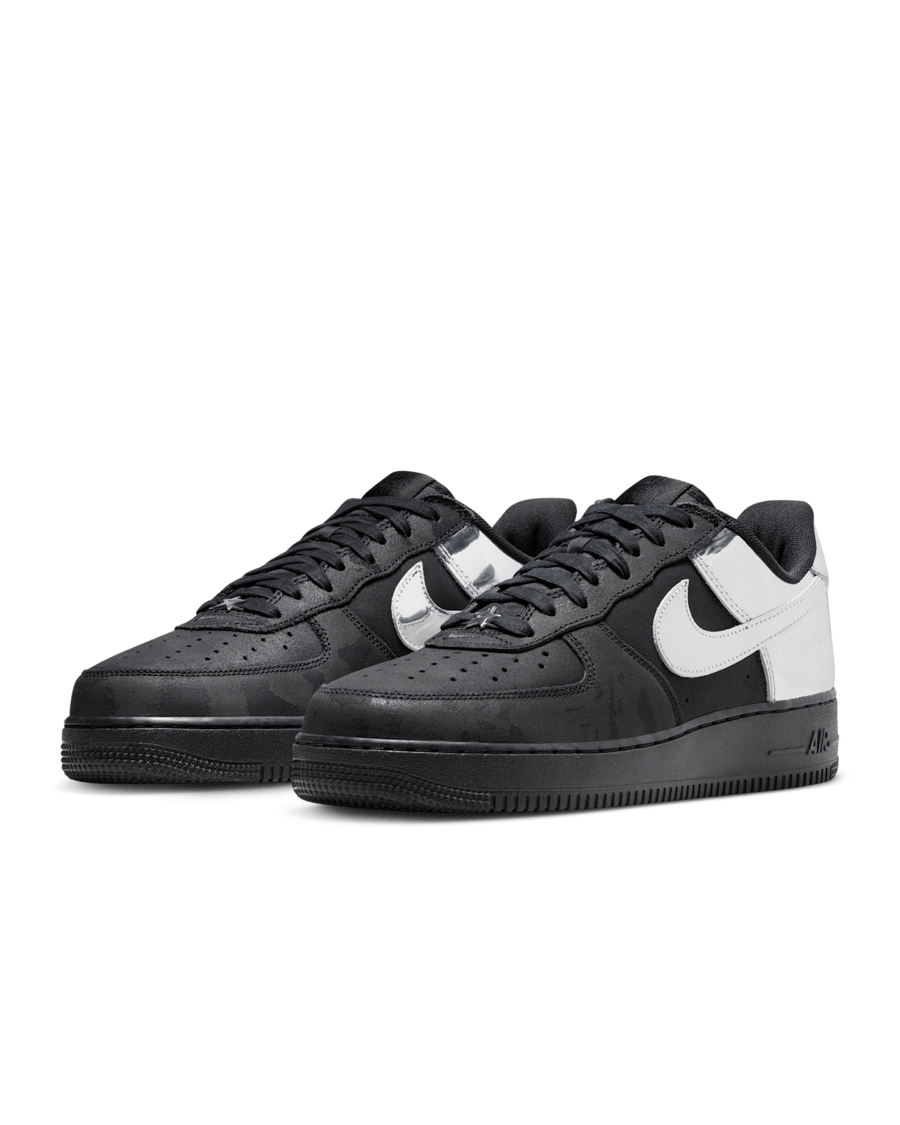 Nike Air Force 1 shoes with black suede upper, chrome accents, reflective graffiti print, and star-shaped dubraes inspired by hip-hop culture