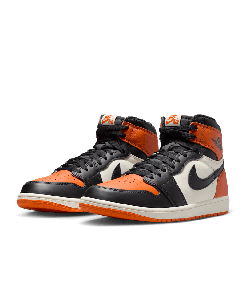 Air Jordan 1 "Shattered Backboard" sneakers with bold orange, black, and white tumbled leather design inspired by MJ’s iconic 1985 dunk in Italy.
