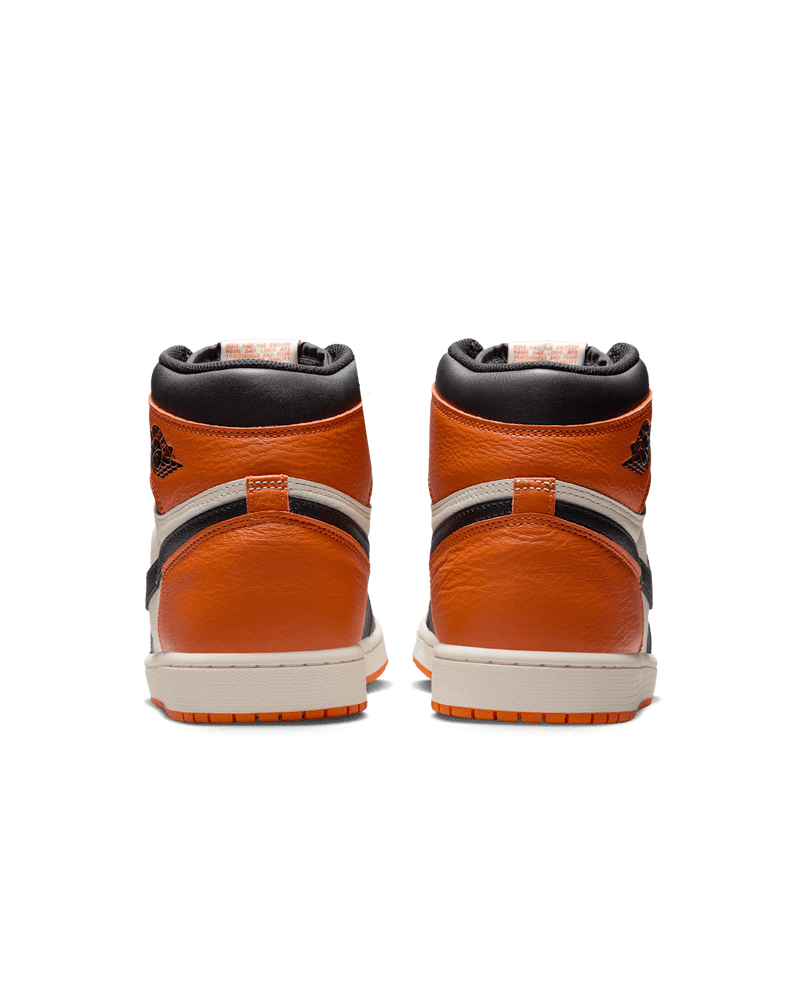 Air Jordan 1 "Shattered Backboard" sneakers with bold orange, black, and white tumbled leather design inspired by MJ’s iconic 1985 dunk in Italy.