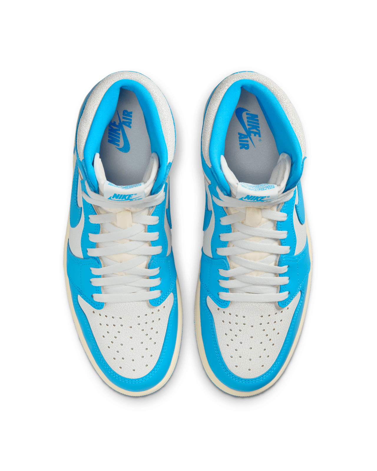 Air Jordan 1 Retro High OG University Blue with distressed leather, Sail and Dark Powder Blue colorway, inspired by Michael Jordan’s college years