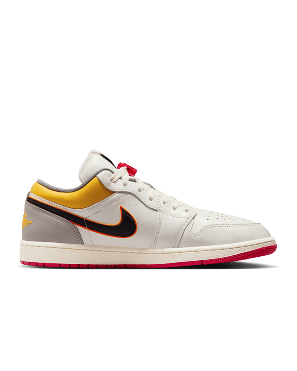 AJ1 Low Premium sneaker with Sail leather upper, Yellow Ochre and College Grey accents, dual-layered Swoosh logos, and Nike Air cushioning.