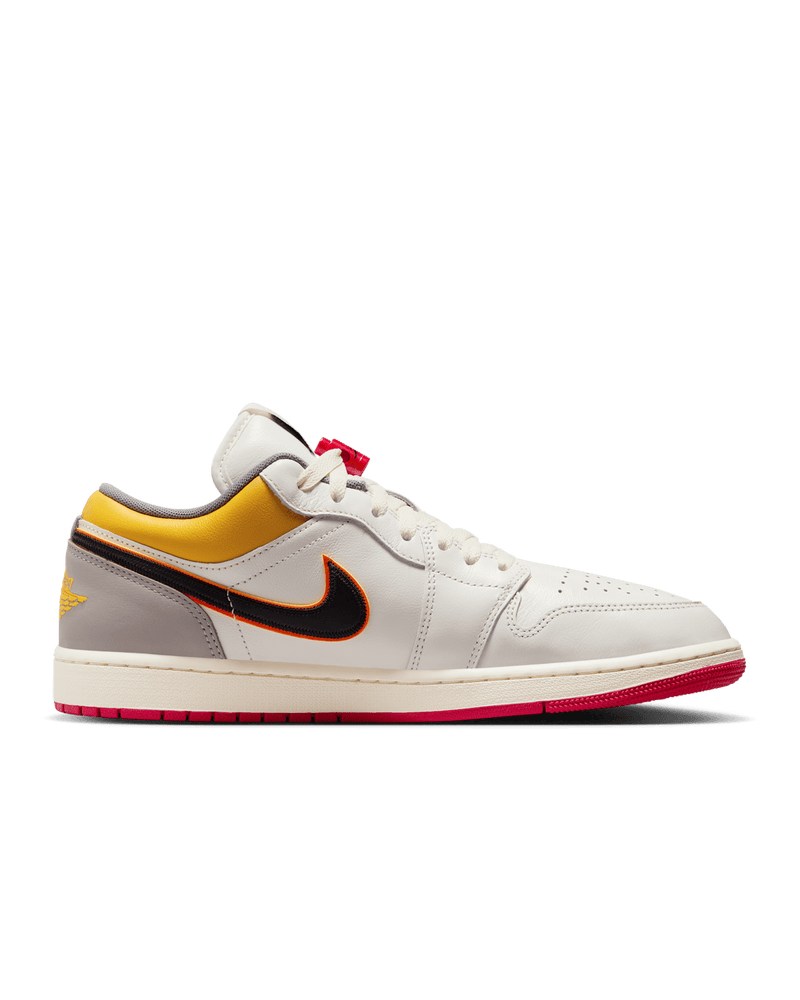 AJ1 Low Premium sneaker with Sail leather upper, Yellow Ochre and College Grey accents, dual-layered Swoosh logos, and Nike Air cushioning.