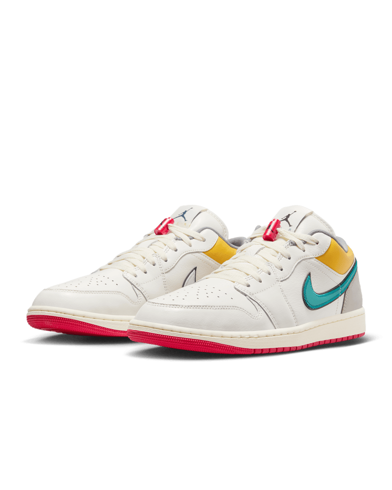 AJ1 Low Premium sneaker with Sail leather upper, Yellow Ochre and College Grey accents, dual-layered Swoosh logos, and Nike Air cushioning.