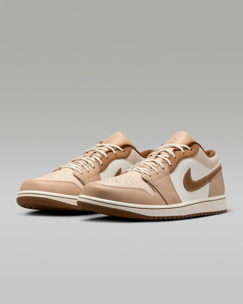 Stylish Air Jordan 1 sneakers made from crisp leather, featuring Nike Air cushioning in the heel and a leather Swoosh logo, showcasing a classic design.