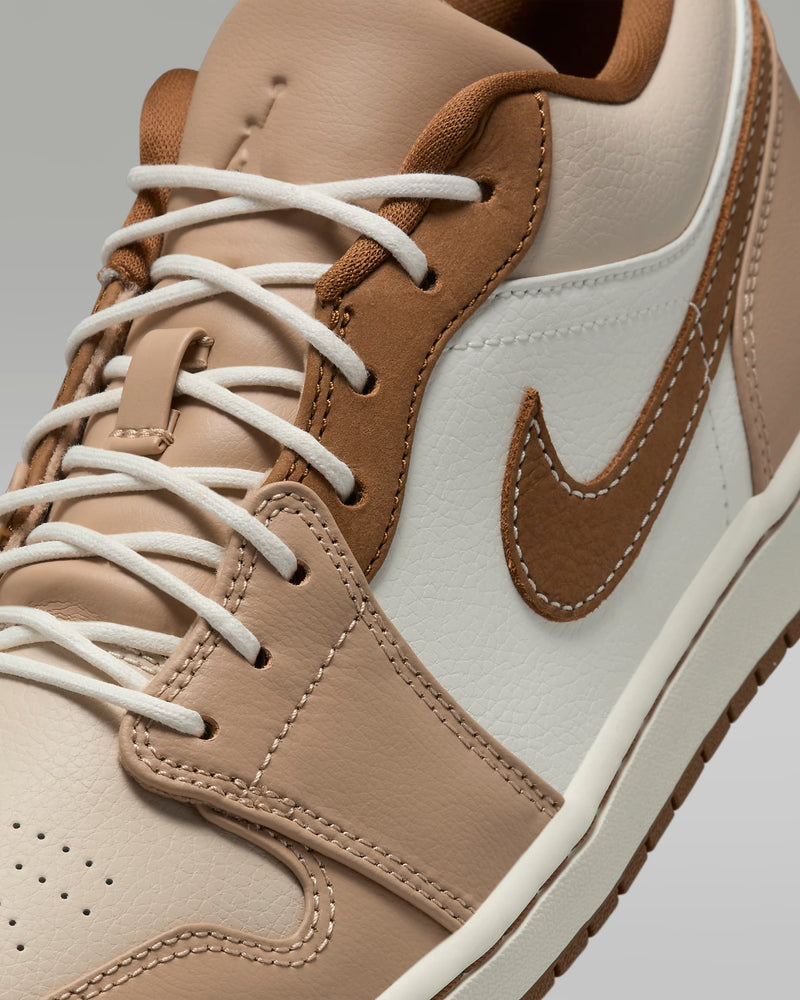 Stylish Air Jordan 1 sneakers made from crisp leather, featuring Nike Air cushioning in the heel and a leather Swoosh logo, showcasing a classic design.