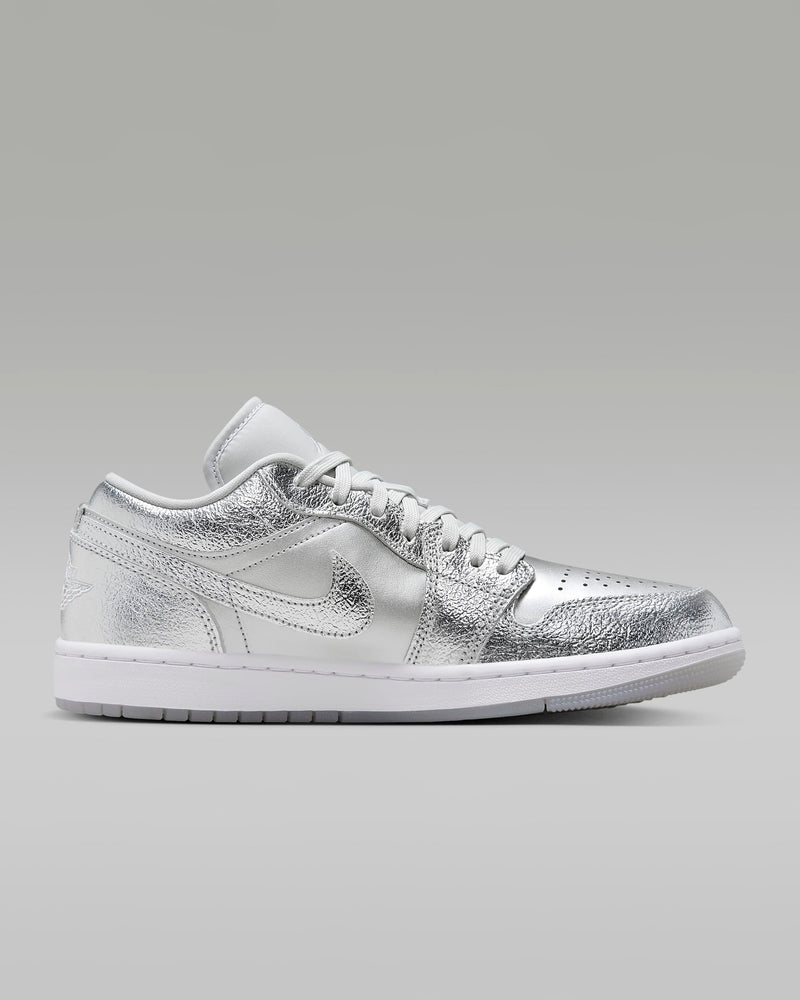 Eye-catching Air Jordan 1 sneaker crafted from luxe metallic cracked leather, featuring premium details like a semi-translucent sole, designed to make a bold statement.