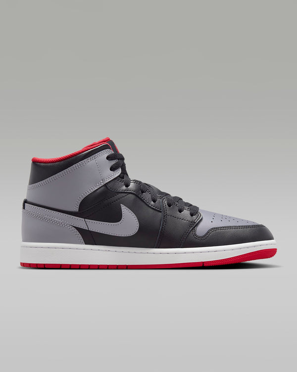 Mid-top sneaker inspired by the original Air Jordan 1, featuring iconic design elements, unique color choices, and crisp leather for a distinct and stylish identity.