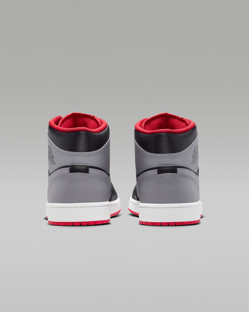 Mid-top sneaker inspired by the original Air Jordan 1, featuring iconic design elements, unique color choices, and crisp leather for a distinct and stylish identity.