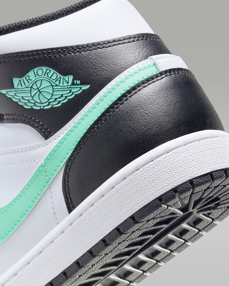 Mid-top sneaker inspired by the original Air Jordan 1, featuring iconic design elements, unique color choices, and crisp leather for a distinct and stylish identity.